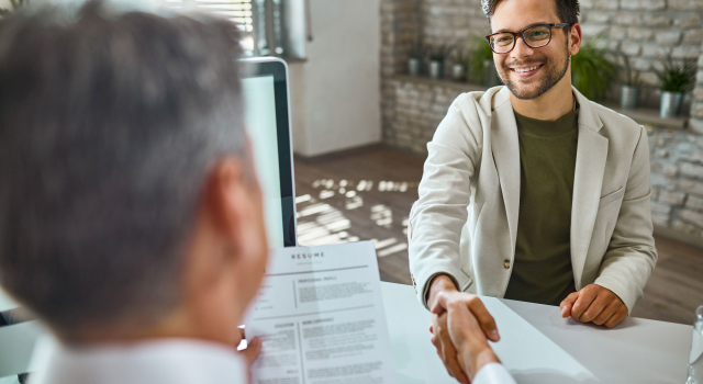happy male candidate greeting member human resource team job interview office2